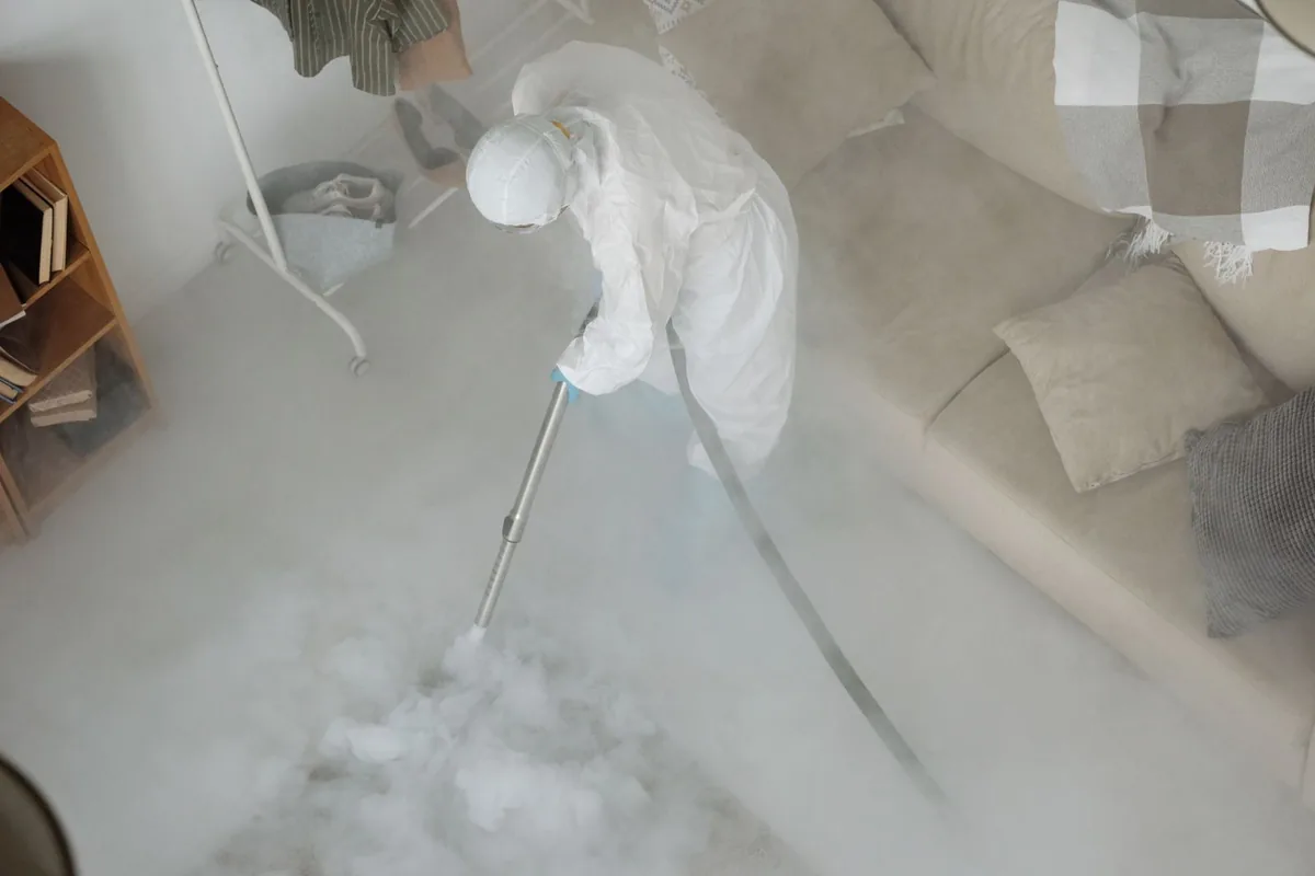 Biohazard cleanup technician in protective equipment, Salem, MA
